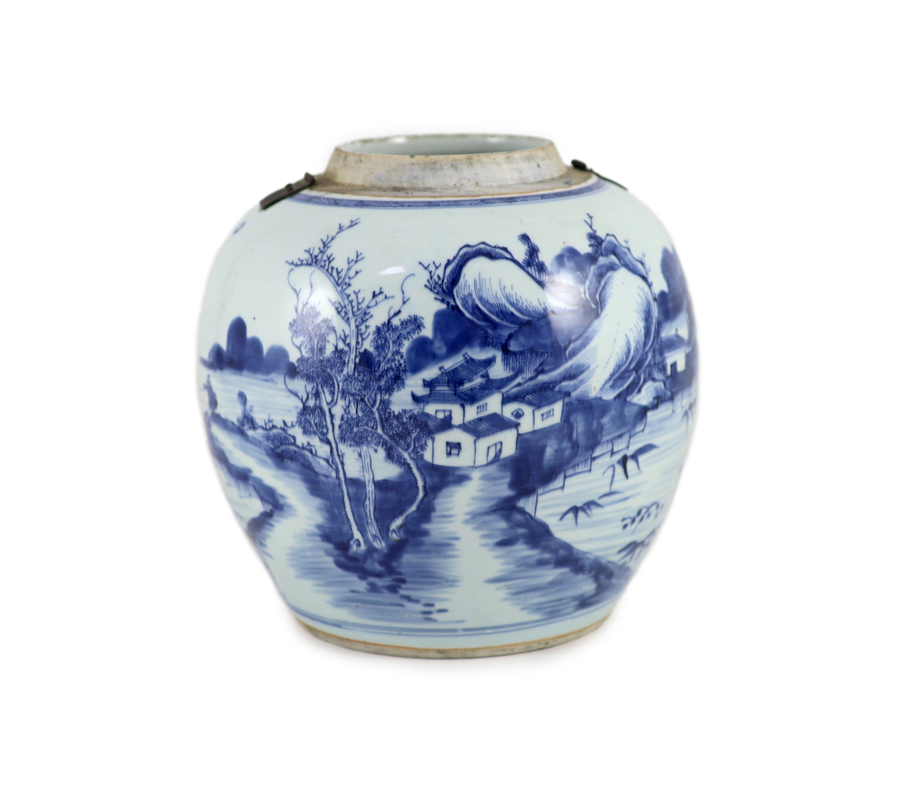 A Chinese blue and white jar and cover, Kangxi period (1662-1722), 23cm high, metal fittings attached to shoulder, Cover repaired and not the best fit